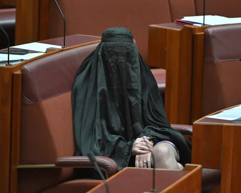 Pauline Hanson's Burqa Stunt Disrupts Senate, Earns Suspension