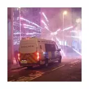 UK Cities Under Siege: Masked Youths Unleash Fireworks on Police in Night of Chaos