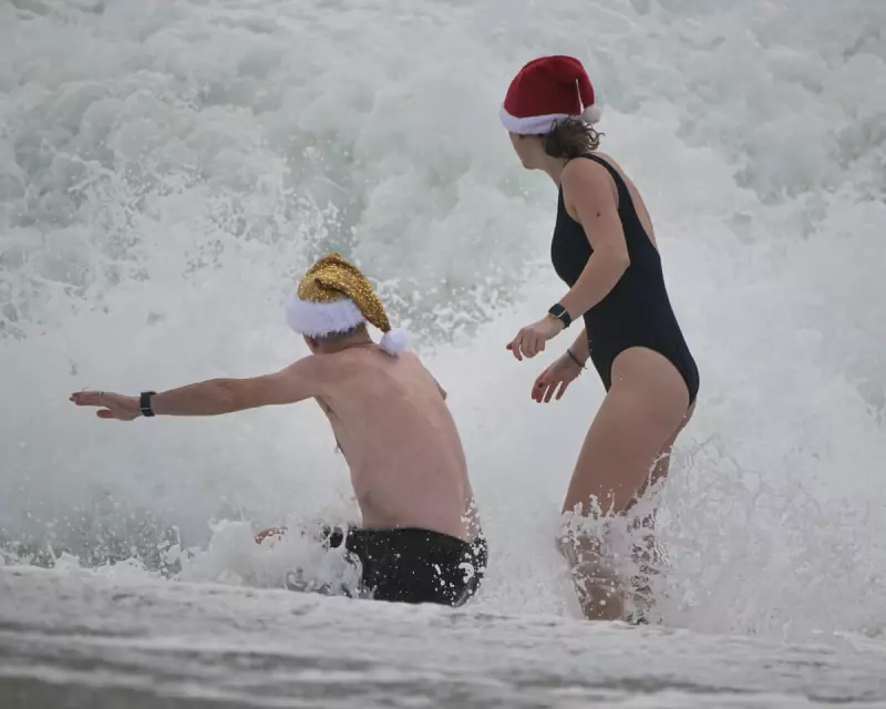 Falmouth's Festive Swimmers Brave Gale-Force Winds as Met Office Issues Warnings