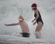 Falmouth's Festive Swimmers Brave Gale-Force Winds as Met Office Issues Warnings