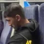 Man hunted after woman sexually harassed and threatened on London train