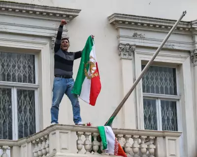 Iranian Protester Pulls Down Flag at London Embassy in Anti-Regime Demonstration