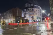 Holland Park Flood Rescue: Residents Evacuated by Boat After Water Main Burst