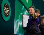 Luke Littler storms into third consecutive PDC World Darts final with 6-1 semi-final win