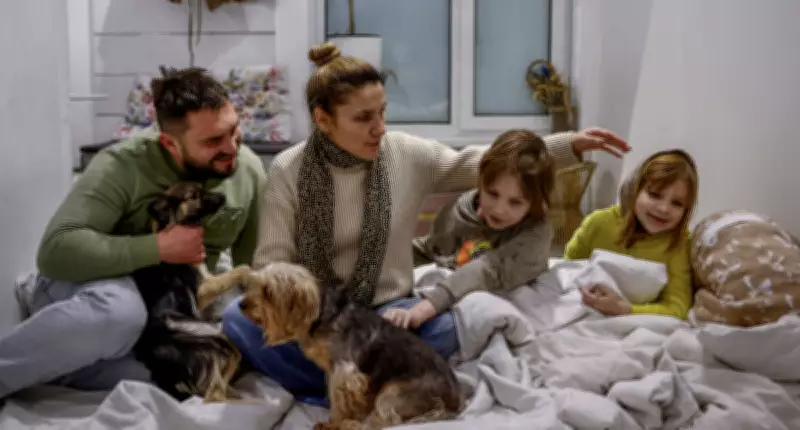 Kyiv Family Endures Russia's Energy Siege, Vows to Stay Until Troops Near