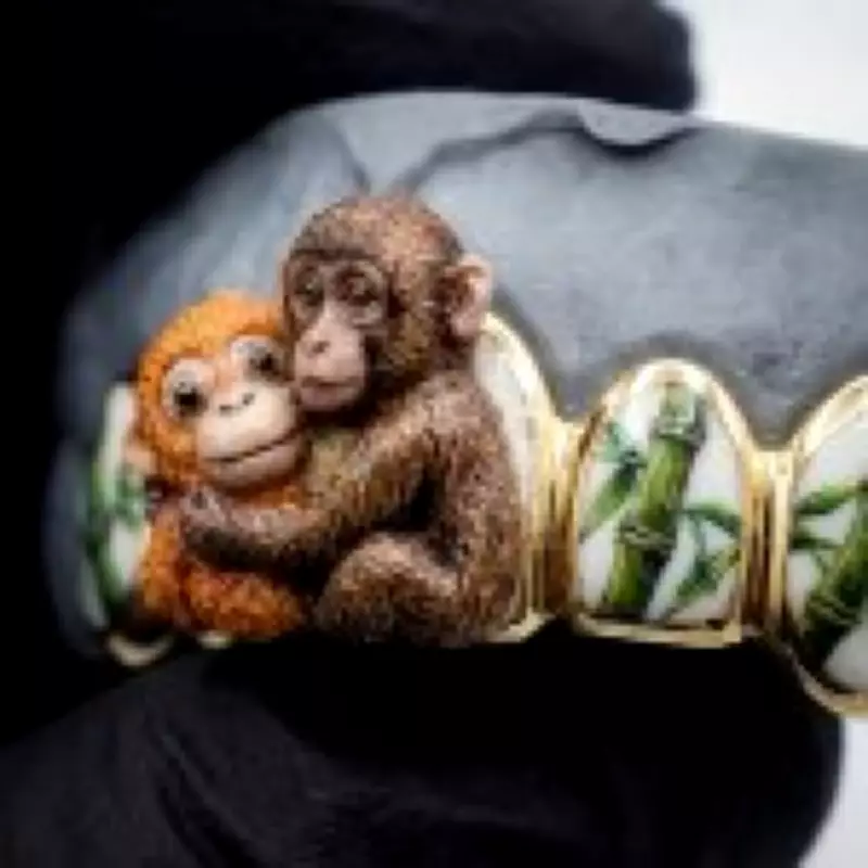 Punch the Abandoned Macaque and Teddy Immortalized in Golden Grill Jewelry