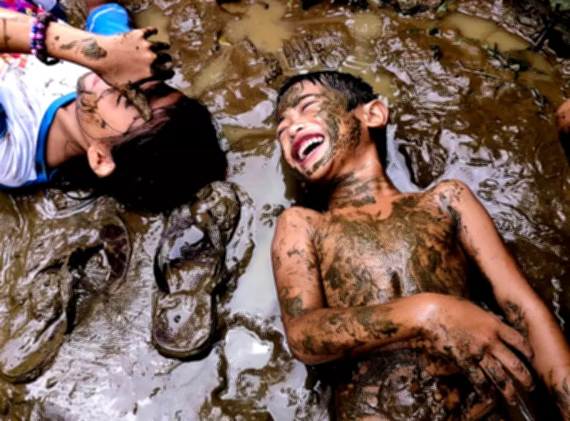 Mark Linel's Padecios Captures Joyful Children in Muddy Play