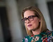 Former Senator Sinema Admits Affair with Guard in Court Filing