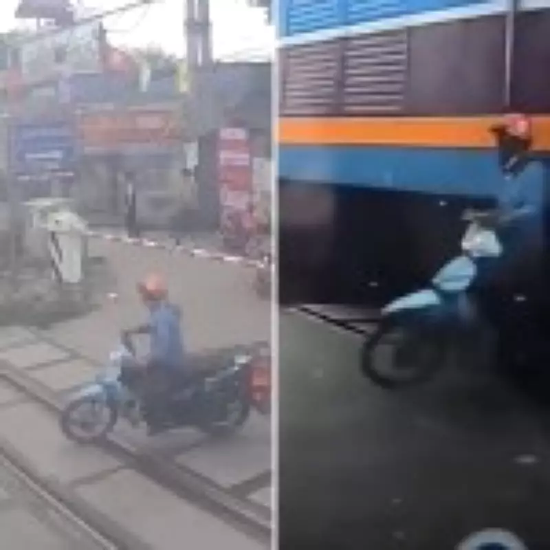 Cyclist Narrowly Escapes Death After Breaching Railway Barrier in Hanoi