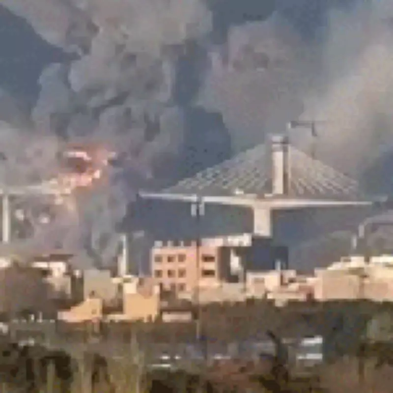 US-Israeli Strikes Destroy Iran's Tallest Bridge Amid Peace Talks, Killing Eight
