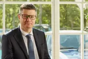Next CEO Simon Wolfson's Pay Soars to £7.4m Amid Price Hike Warnings