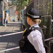 Shadwell Café Sealed Off After Fatal Stabbing: Police Investigation Continues