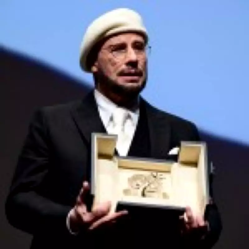 John Travolta Overcome with Emotion at Cannes as He Receives Surprise Honorary Palme d'Or