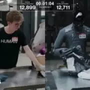 Factory Worker Beats Robot in Package Sorting Challenge, Barely