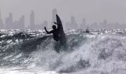 Global Photo Highlights: Surfing, Cheese Race, and More from Monday
