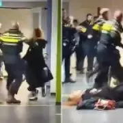 Pregnant woman dragged by hair by police in Netherlands viral video