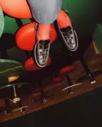 Tilted Loafers and Red Socks: Olivier Lei's Vibrant Bar Photo