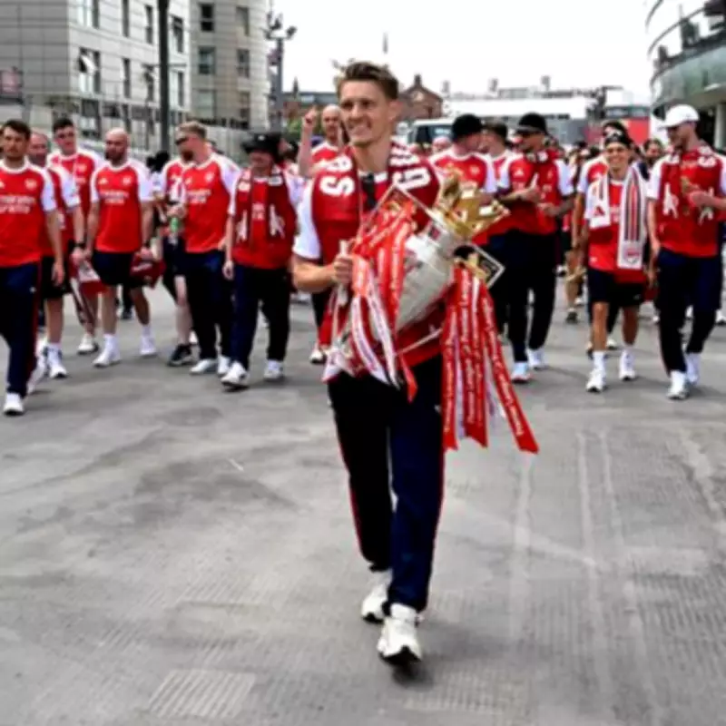 Arsenal's Odegaard hilariously hits police officer with ball during trophy parade