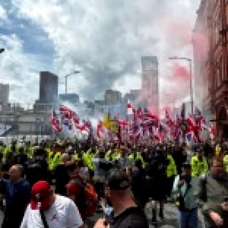 Hundreds of Britain First supporters march through Birmingham with flares