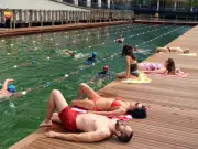 London's first floating natural water swimming pool opens in Canary Wharf