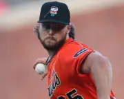 MLB criticizes Giants players who wrote Bible verses on Pride caps