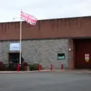 Staff at UK immigration centres wore England flags on uniforms, report reveals