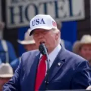 Trump jokes about 'having a threesome' with his two sons at library event